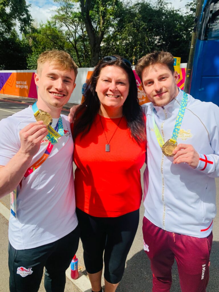 Louise Bishop with Jack Laugher, left, and Anthony Harding - Paris 2024 Olympics